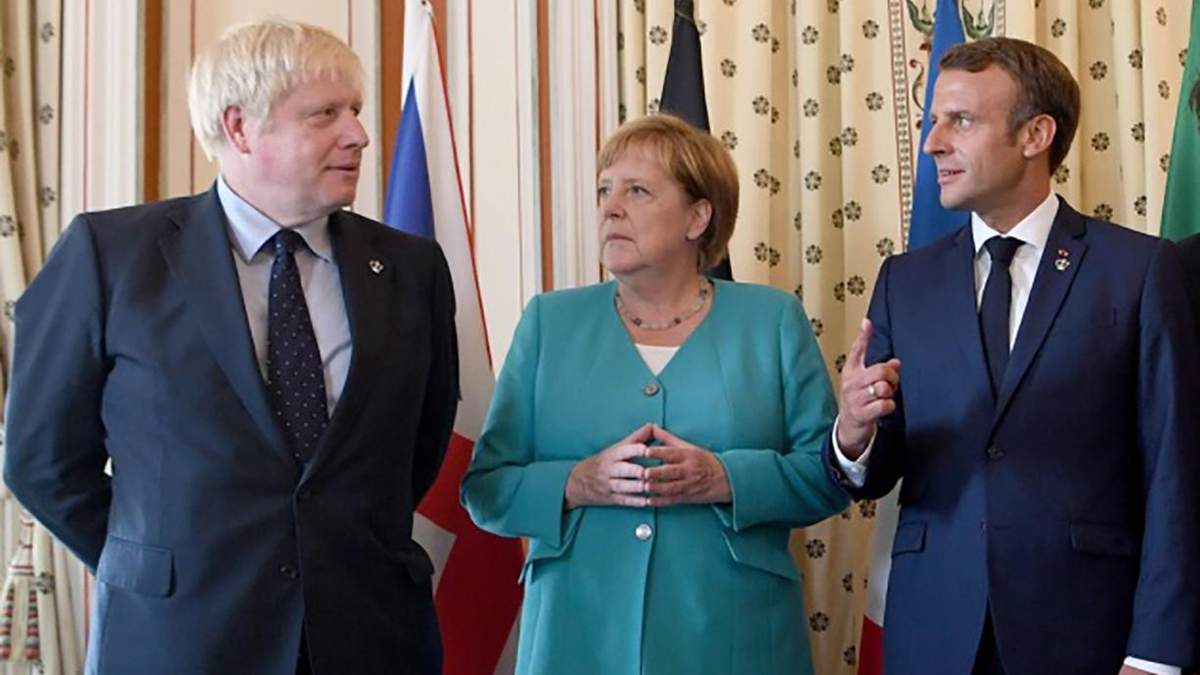 Борис Джонсон, Ангела Меркель і Еммануель Макрон Борис Джонсон, Ангела Меркель і Еммануель Макрон